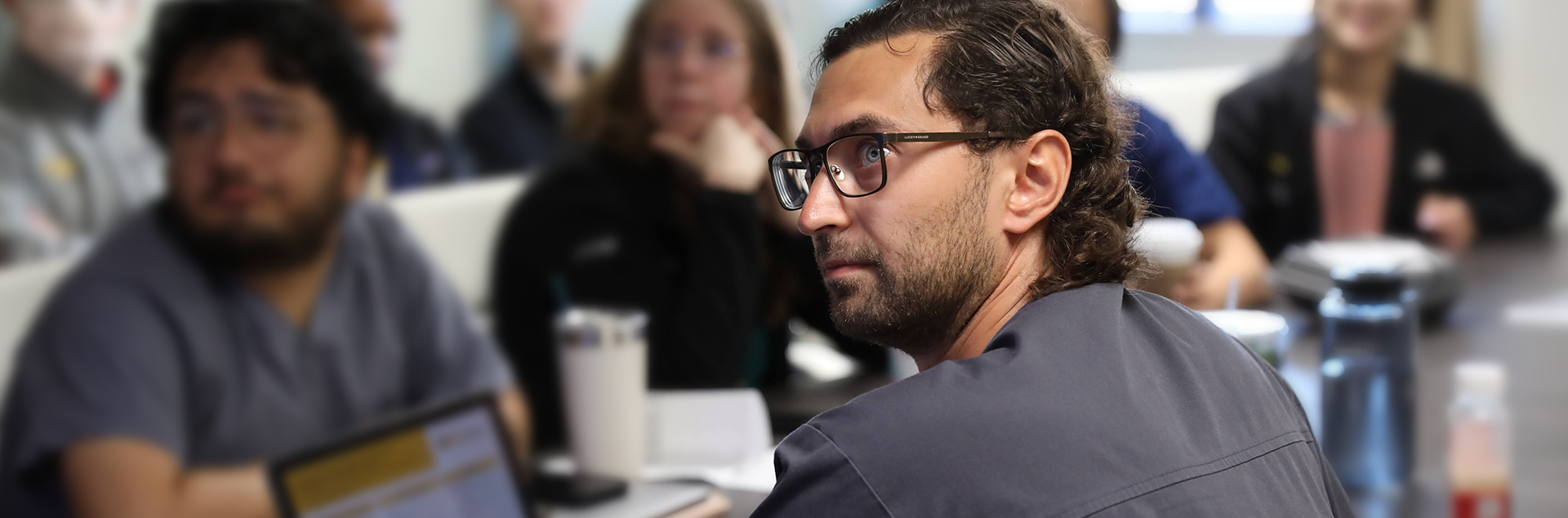 Medical students in class, listening to a lecture